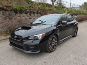 Premium car tint installed on a black Tesla Model Y by Tint Pro.